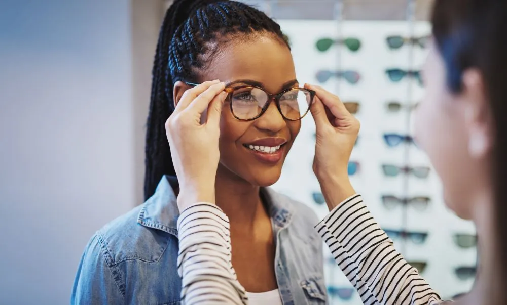 Woman trying on glasses