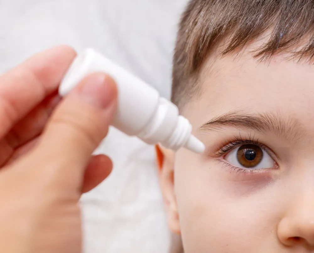 Child getting eye drops